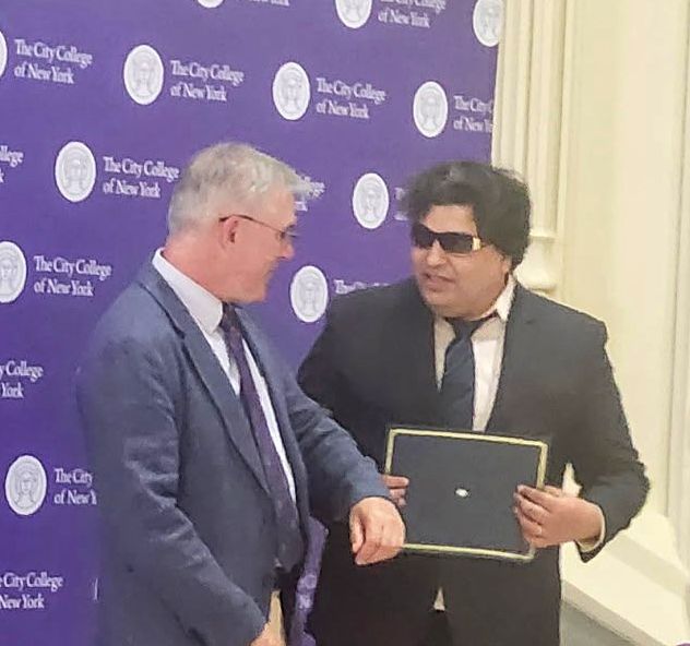 Professor Chatterjee with President Boudreau